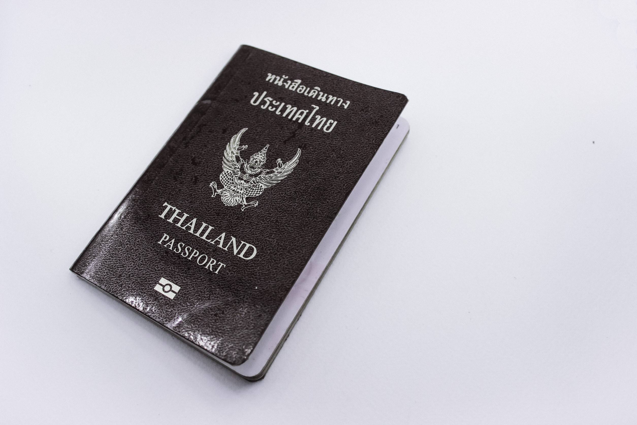 A Thailand Passport On A White Background
