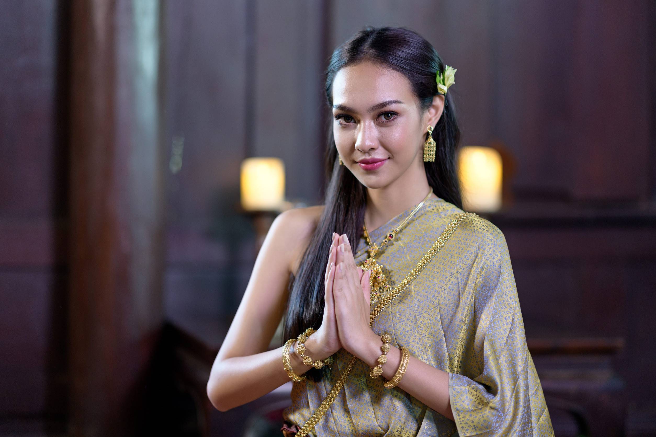 A Young Thai Woman Wearing A Traditional Thai Dress And Jewellery