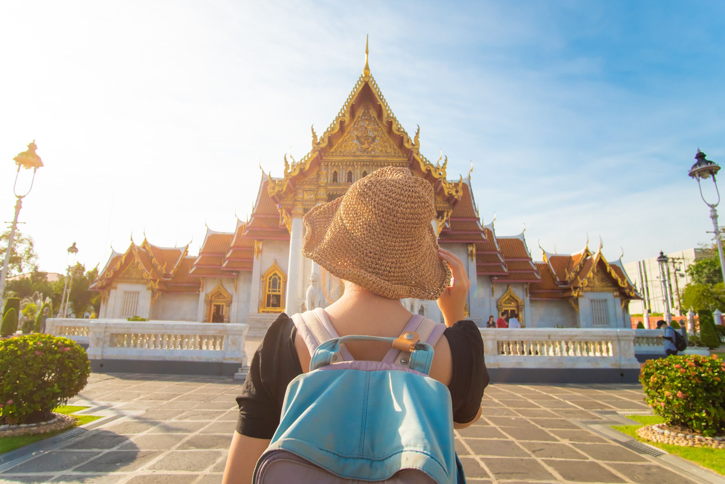 Backpacker Asian Women Travel In Busshist Temple Sunny Day In Bangkok Thailand