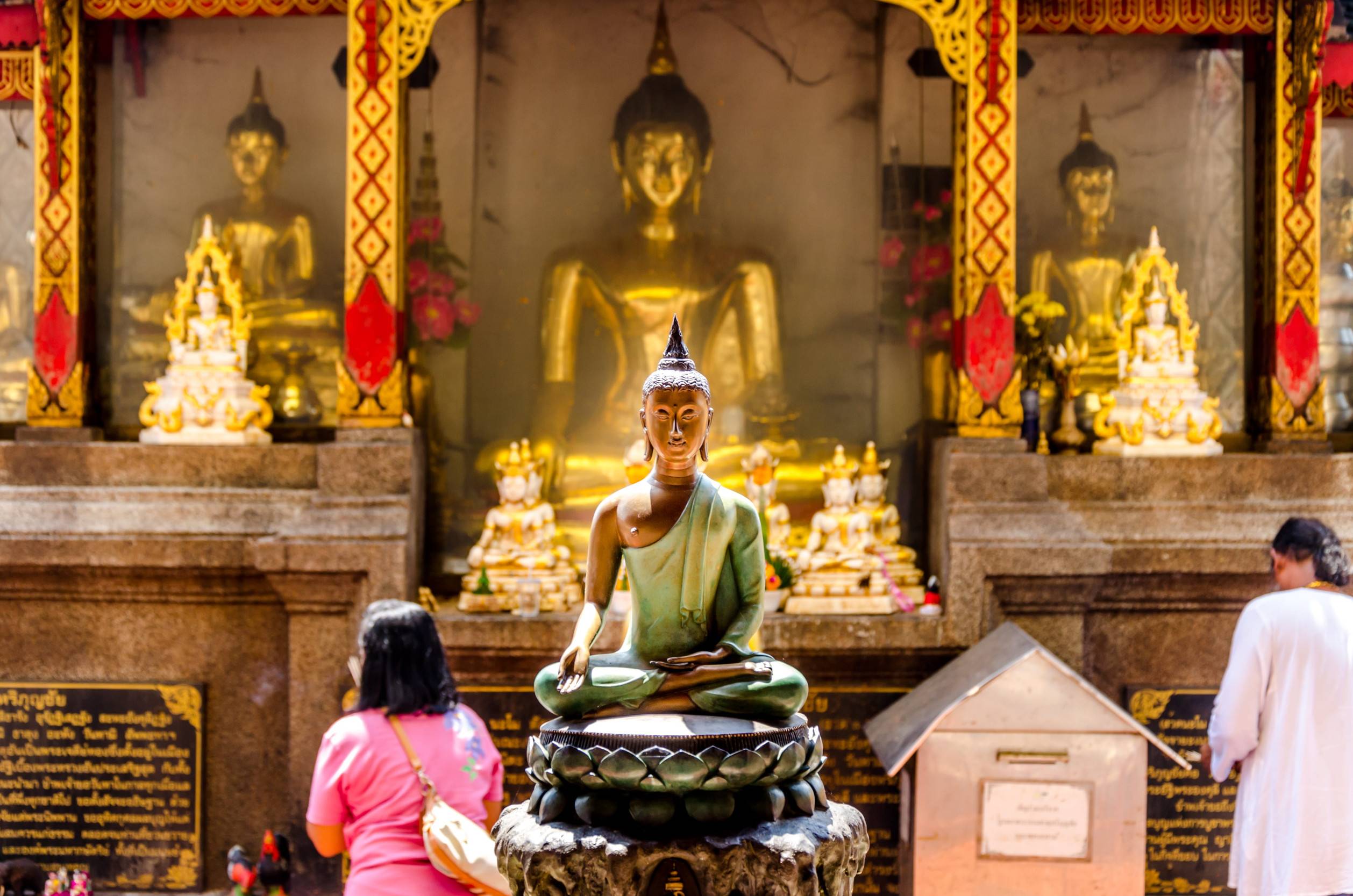 Statues Of Buddha Inside A Temple In Thailand