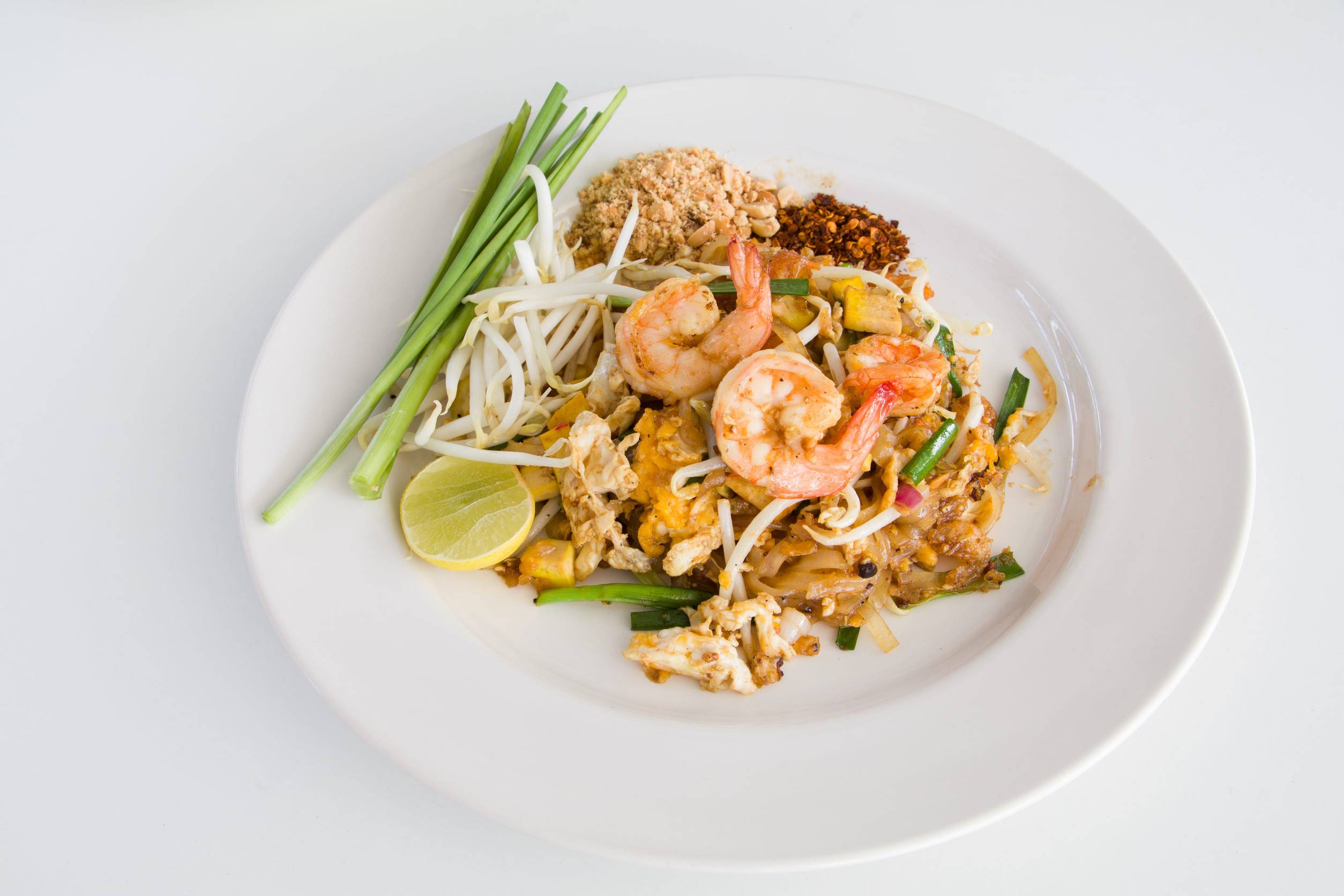 Traditional Pad Thai Of A White Plate In Front Of A White Background Traditional Pad Thai Of A White Plate In Front Of A White Background