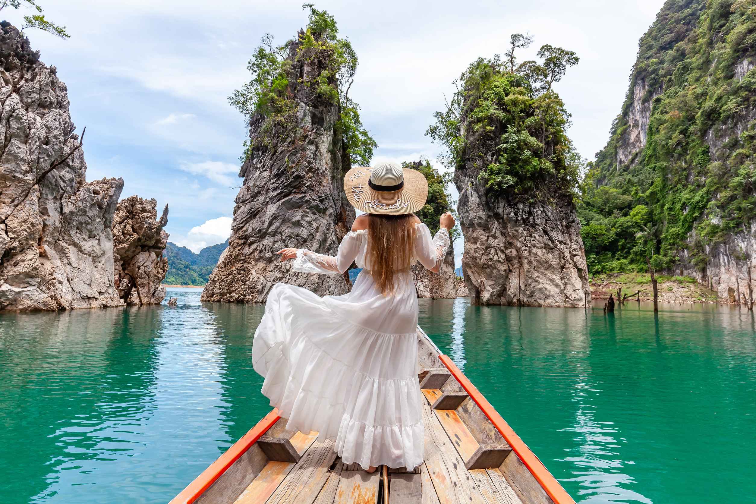 Woman On Boat Near Famous Guilin Rocks In Khao Sok National Park In Thailand