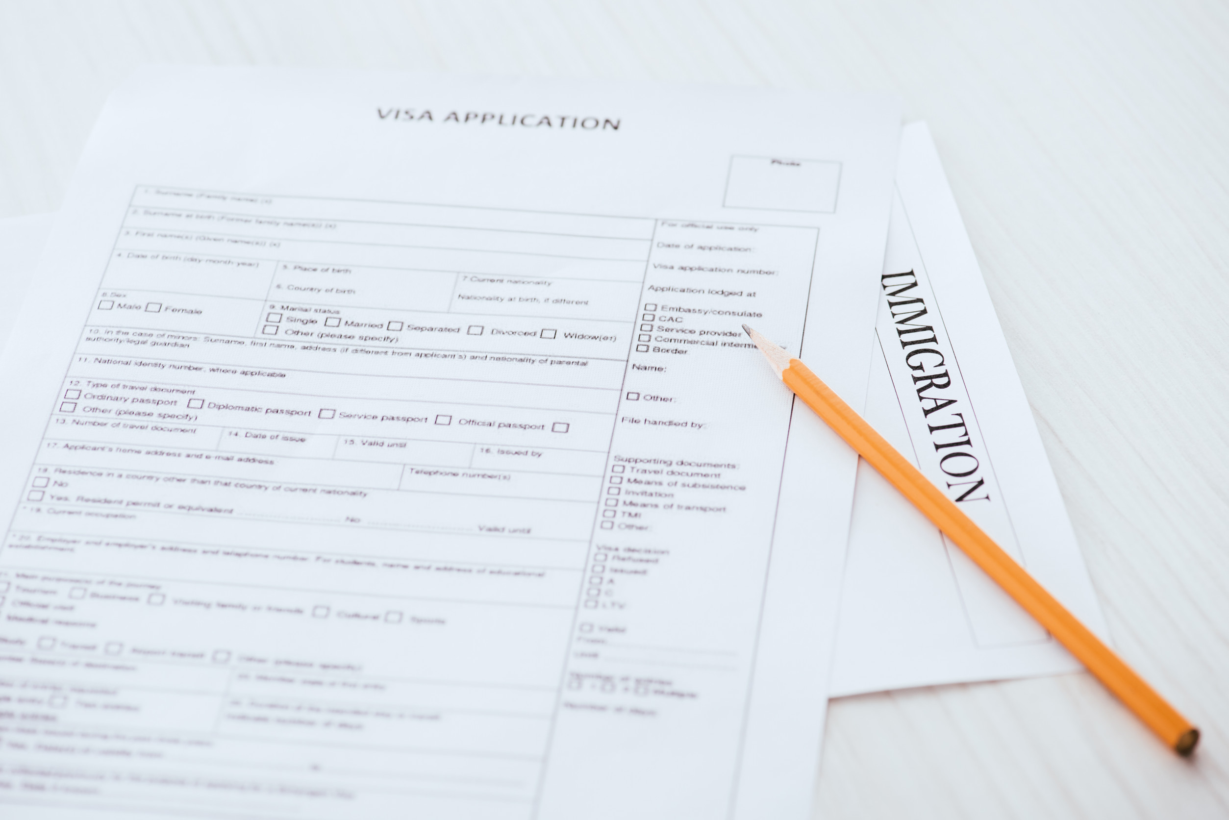 Wooden Pencil Near Document With Visa Application